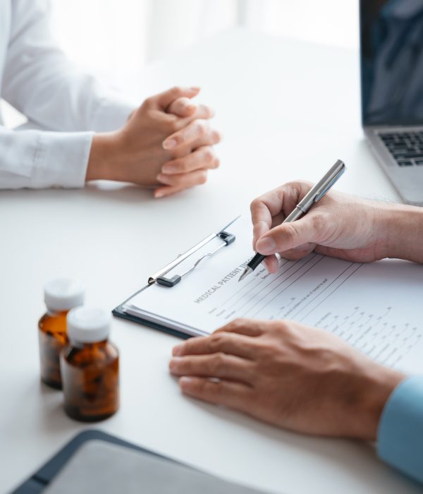 Close-up hands of doctor treatments and consults on patient in clinic medical office or hospital.